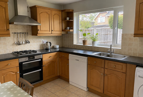 Brown kitchen cupboards before painting in Dunstable