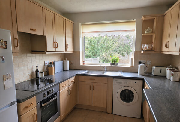 Yellowed kitchen units before repainting in Dunstable