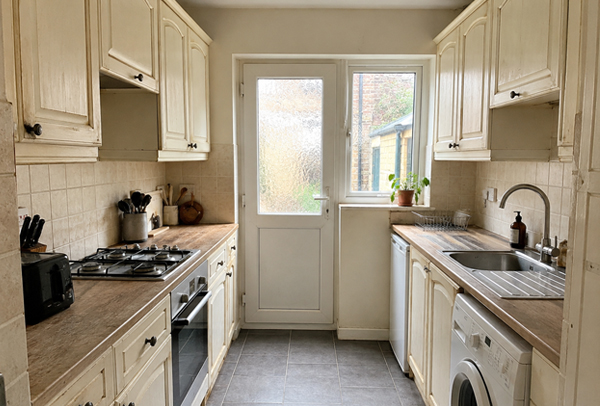 Honey oak kitchen cupboards before painting in Dunstable
