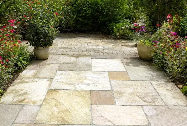 Before sandstone patio cleaning results in Milton Keynes