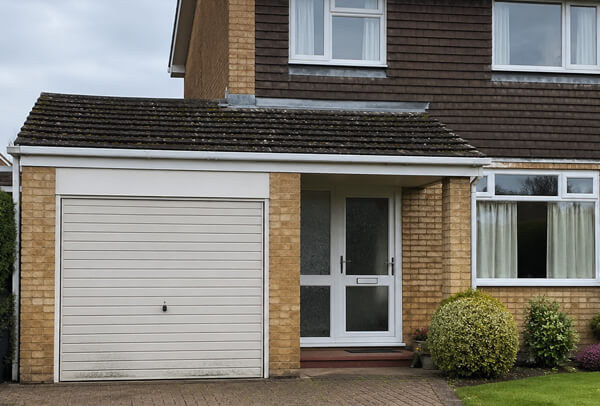 Aluminium garage door in Luton before spraying, with an old dull colour