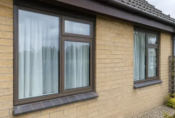 Aluminium window frames in Northampton before painting, with a dull dated finish