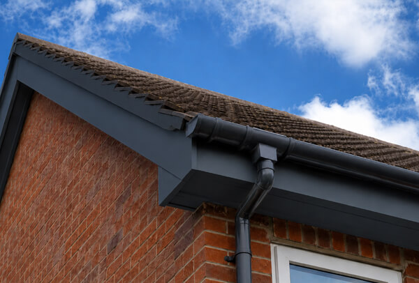Bargeboards gutters and downpipes in Bedford after exterior painting