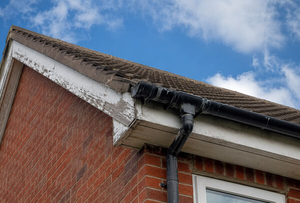 Bargeboards gutters and downpipes in Bedford before exterior painting
