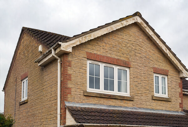 Bargeboards and gutters before painting in Milton Keynes