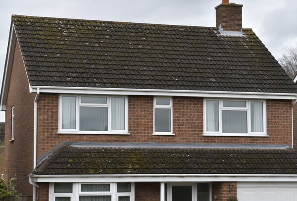 Bedford roof before cleaning with dark patches, moss growth and uneven staining