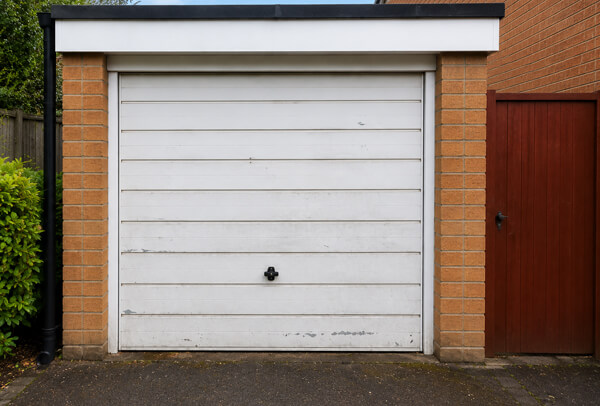 Garage door in Bedford before painting, with a tired and faded finish