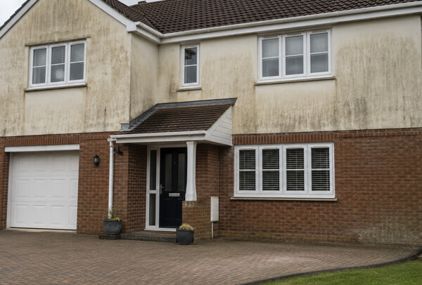 Bedford house exterior before washing with wall marks left after other outside cleaning