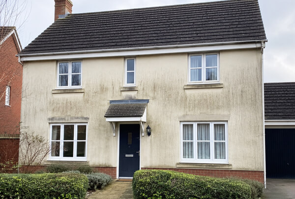 House exterior in Bedford before washing, with dull walls and visible weather marks