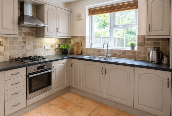Kitchen cupboards in Bedford after painting, with a fresh updated finish