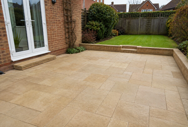 Patio in Bedford after cleaning, with brighter paving and a cleaner outdoor space
