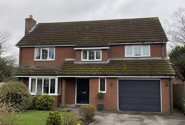 Bedford roof before cleaning shown from ground level for a photo quote
