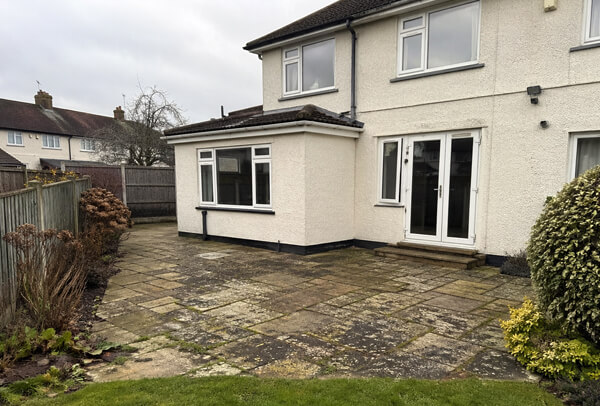 Patio in Northampton before professional cleaning, with a tired weathered appearance