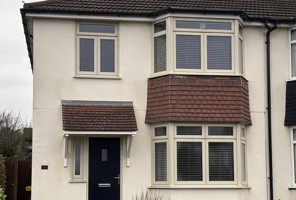Composite window frames in Northampton before painting, looking dated and uneven in appearance