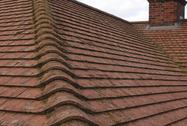 Before concrete tile roof cleaning results in Milton Keynes
