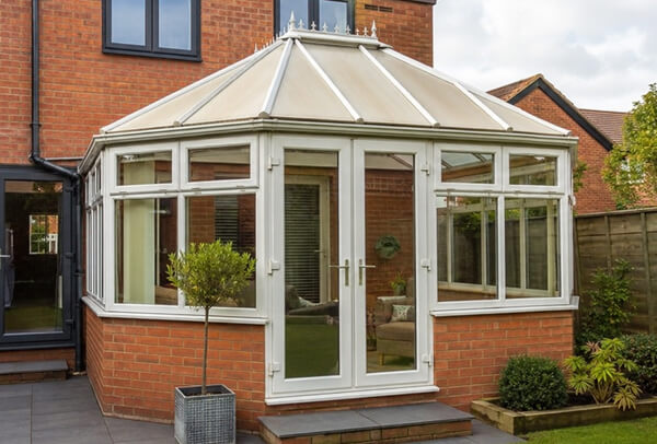 Bedford conservatory before frame painting with a colour that does not match the home