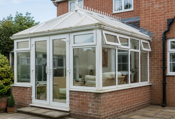 Conservatory before painting with older white frames