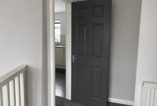 Door in Luton after painting preparation and finishing, showing a smooth clean result