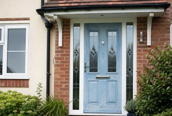 External door in Luton before painting, showing a faded surface ready for a new finish