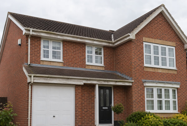 Roofline in Luton before colour change with faded fascia soffit and gutter details