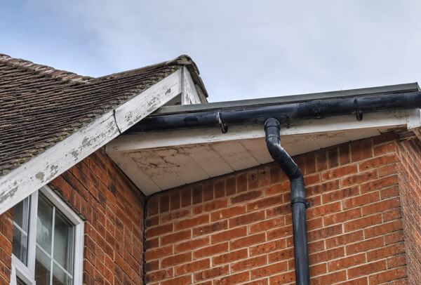 Oxford roofline before painting with faded fascia soffit gutter and bargeboard details