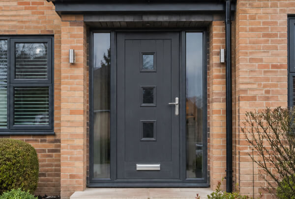 Front door in Luton after painting, matching the windows, garage door and exterior trims