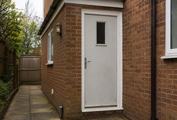 Front door before preparation, ready to be cleaned, masked and refinished