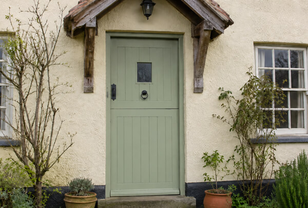 Front door after painting, with a colour that works better with the surrounding exterior features