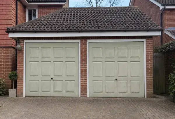 Faded and weathered garage door before repainting