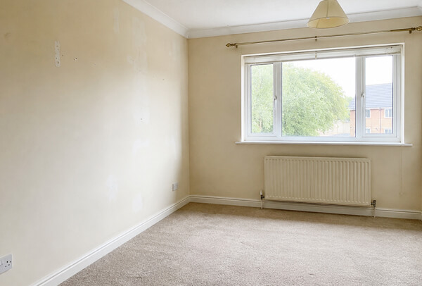 Bedroom wall in Hemel Hempstead before repainting with scuffs and uneven colour