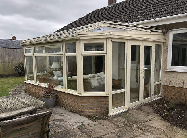 Conservatory before painting showing glass and frame details