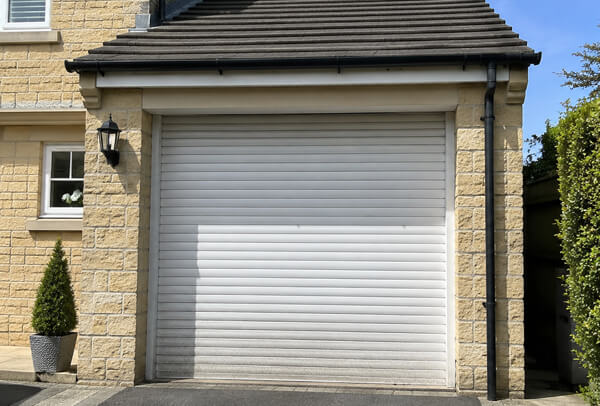 Garage door before repainting viewed from the driveway