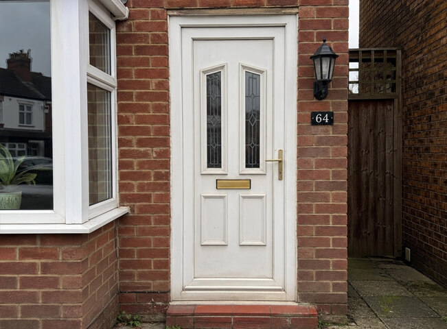 Front door before painting with exterior details that need a better colour balance