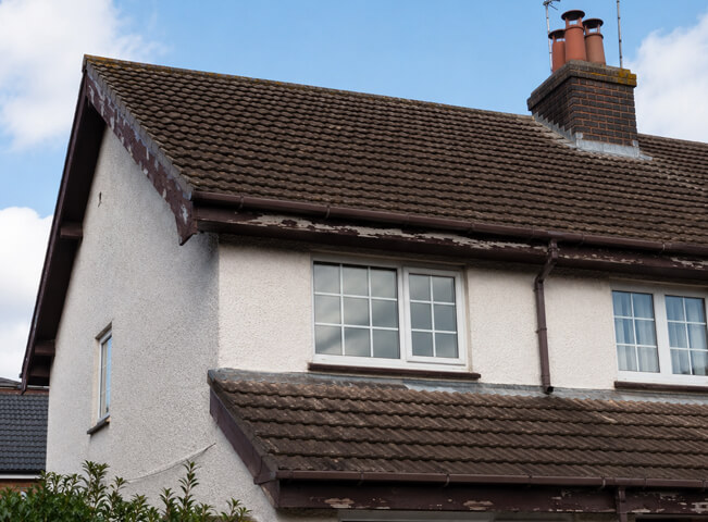 Fascia and soffit before painting in Hemel Hempstead showing a tired roofline surface