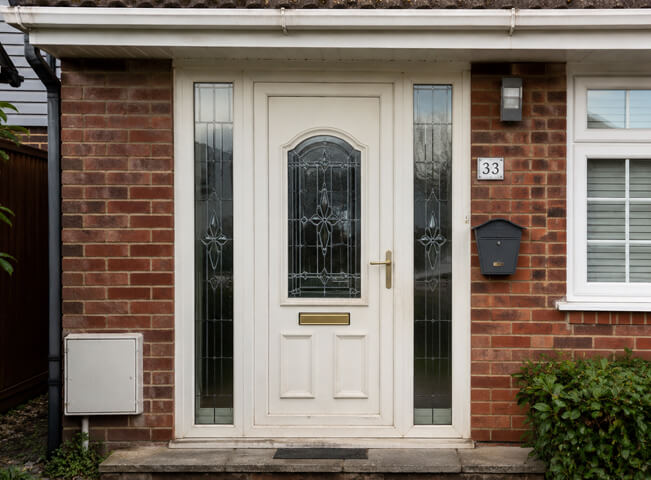 Front door before colour planning with a dated plain finish