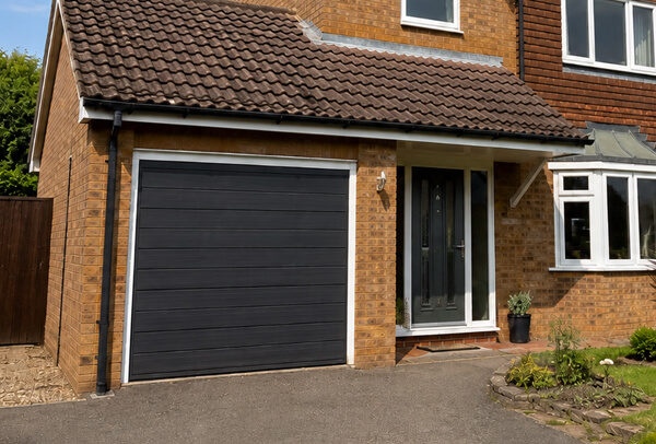 Working garage door after repainting with a fresh exterior colour