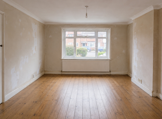 Hemel Hempstead living room before painting, with marked walls and tired woodwork