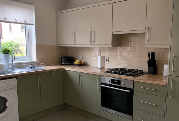 Repainted kitchen units after a practical cabinet update