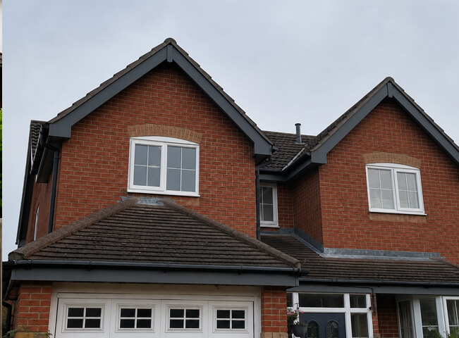 Hemel Hempstead roofline after painting with neat fascias soffits gutters and roof edge trim