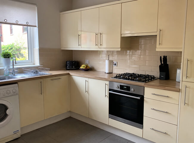 Strong but dated kitchen units before cabinet painting