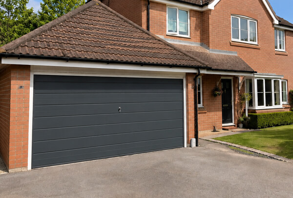 Weather worn garage door after careful preparation and repainting