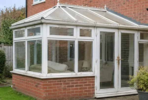 Conservatory in High Wycombe before frame painting with an older faded finish
