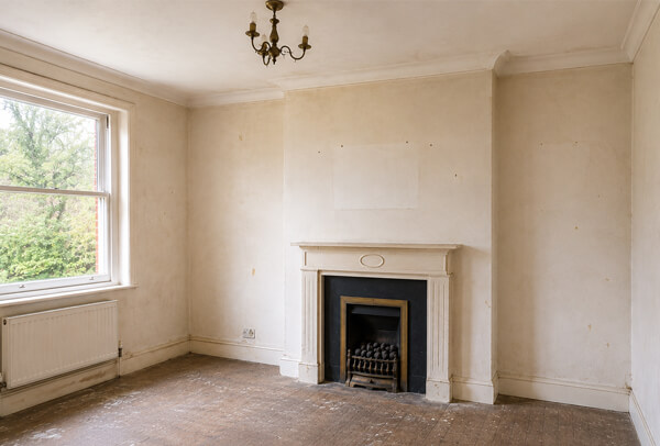 High Wycombe living room before decorating with marked walls and tired painted woodwork