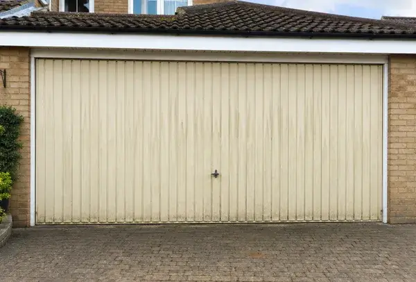 Worn garage door before being repainted