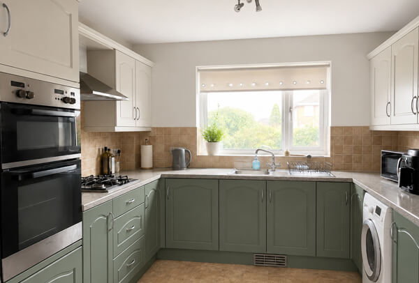 Kitchen cupboards after painting with a cleaner modern finish
