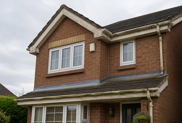 High Wycombe roofline before painting with tired fascias soffits gutters and bargeboards