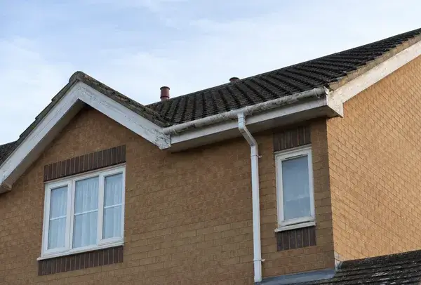 Roofline in High Wycombe before painting with tired fascias soffits bargeboards and gutters