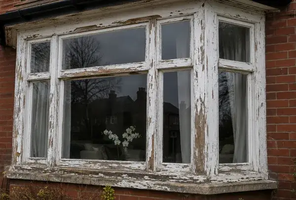 Timber window frames before preparation and painting in High Wycombe