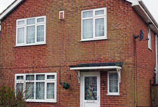 House exterior in Northampton before washing, with dirty outside walls and weather staining