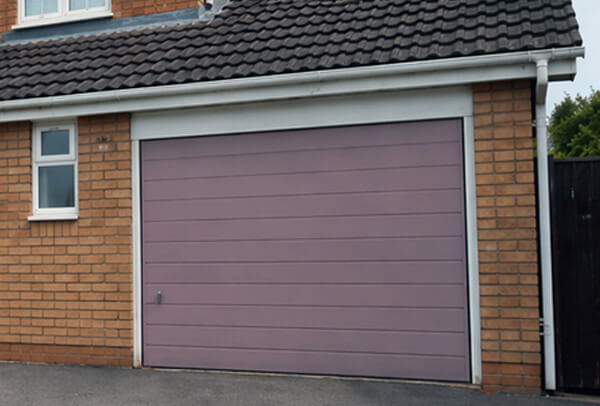 Fibreglass garage door in Northampton after painting, with a cleaner updated look